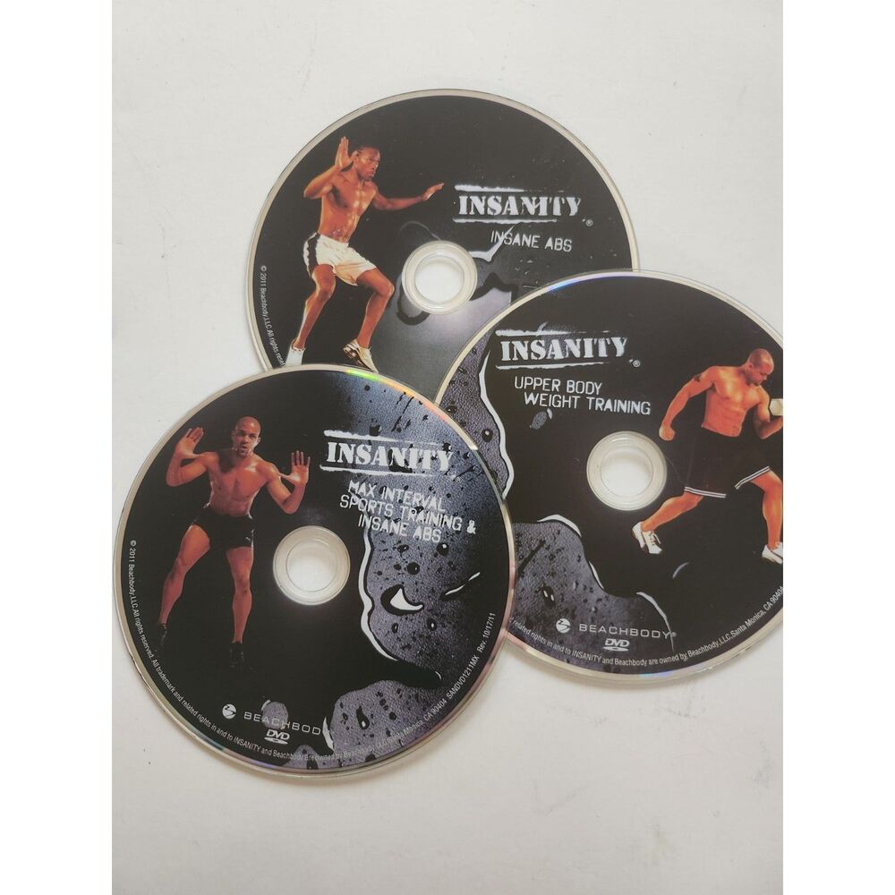 Three workout DVDs from the Insanity 60-day high-intensity fitness B33